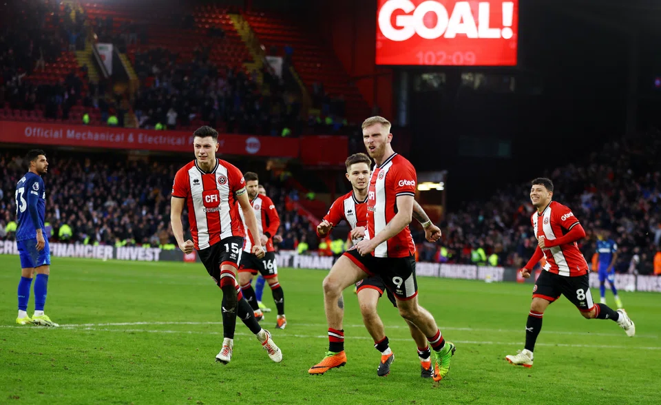 Sheffield United's Oli McBurnie (second from right, wearing No 9 on the shorts) celebrating with his teammates after netting a penalty in the 103rd minute against West Ham last weekend.