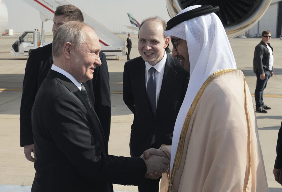 Russia's President Vladimir Putin meeting UAE Foreign Minister Sheikh Abdullah Zayed upon arrival at the airport in Abu Dhabi on Dec 6, 2023. 