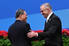 China’s Premier Li Qiang (left) greeting Australia’s Prime Minister Anthony Albanese during the China International Import Expo; China’s No 2 official vows “to protect the rights and interests of foreign investors in accordance with the law”.
