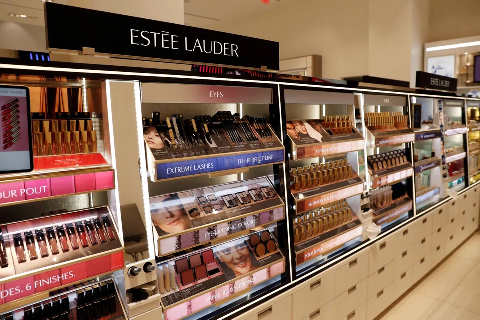 Analysts note reduced consumer demand in China and a slow recovery in Asian travel retail, affecting luxury firms like Estee Lauder. 