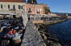 Locals and tourists in the old town of Chania (La Canee) in the north west of the island of Crete.  The Mediterranean nation recorded November temperatures comfortably exceeding 20 deg C.