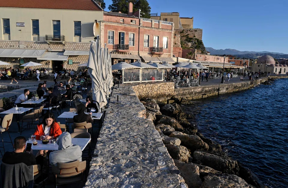 Locals and tourists in the old town of Chania (La Canee) in the north west of the island of Crete.  The Mediterranean nation recorded November temperatures comfortably exceeding 20 deg C.