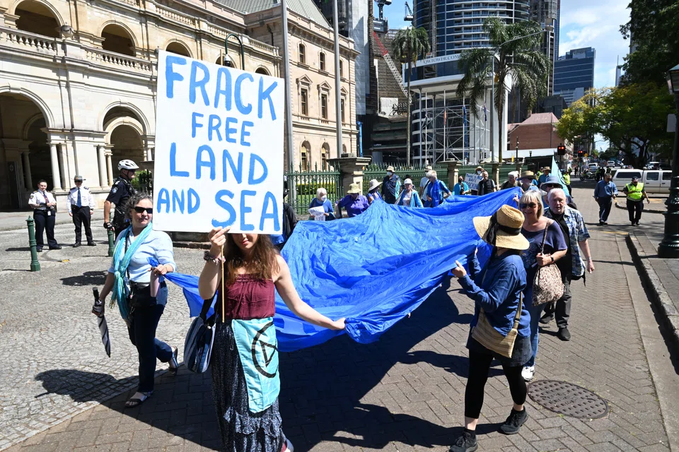 An anti-fracking protest in Brisbane, Australia, Sept 14, 2022. Origin Energy said on Monday it would sell its stake in a major fracking project that has come under criticism.