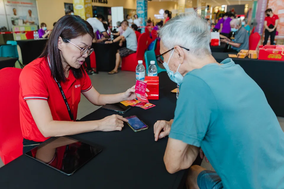 About 250 senior citizens learn how to make cashless payments and spot scams at the first set of Digital for Life workshops.
