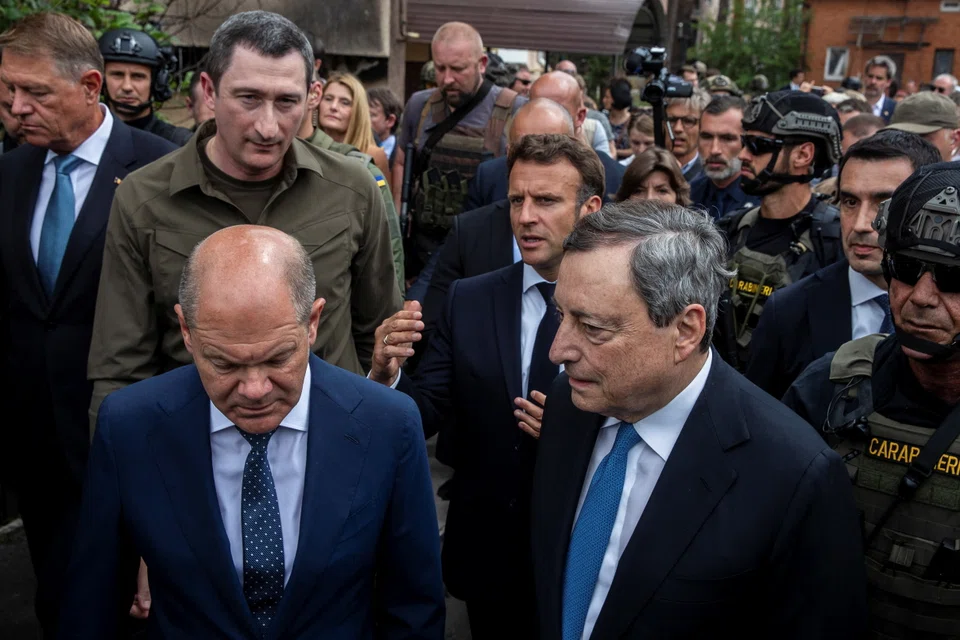 Ukrainian Minister for Communities and Territories Development Oleksiy Chernyshov talks to French President Emmanuel Macron, German Chancellor Olaf Scholz, Italian Prime Minister Mario Draghi and Romanian President Klaus Iohannis, during their visit, as Russia's attack on Ukraine continues, in Kyiv, Ukraine June 16, 2022.  