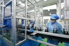 Workers on the production line of lithium-ion batteries for electric vehicles (EV) in China's Zhejiang province.  