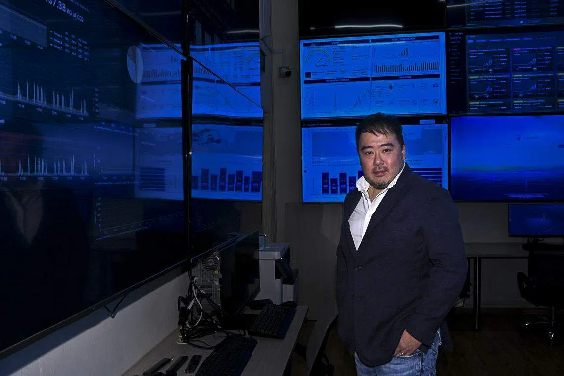 EDPR Sunseap's business chief executive officer Frank Phuan in its monitoring room. The company, which won an Emerging Enterprise Award in 2014 as a solar lessor, now has a comprehensive range of green products and services. 