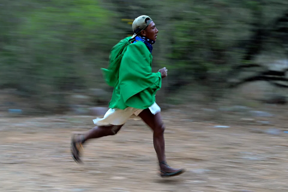 A Raramuri (Tarahumara) competing in the "Caballo Blanco" (White Horse) ultramarathon in the Tarahumara mountains in Mexico's  Chihuahua state on Sunday (Mar 5). 
They do not wear fancy running shoes, but just simple sandals known as huaraches, made of discarded car tyres.  