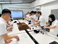 LReit volunteers bake and distribute muffins to beneficiaries. 