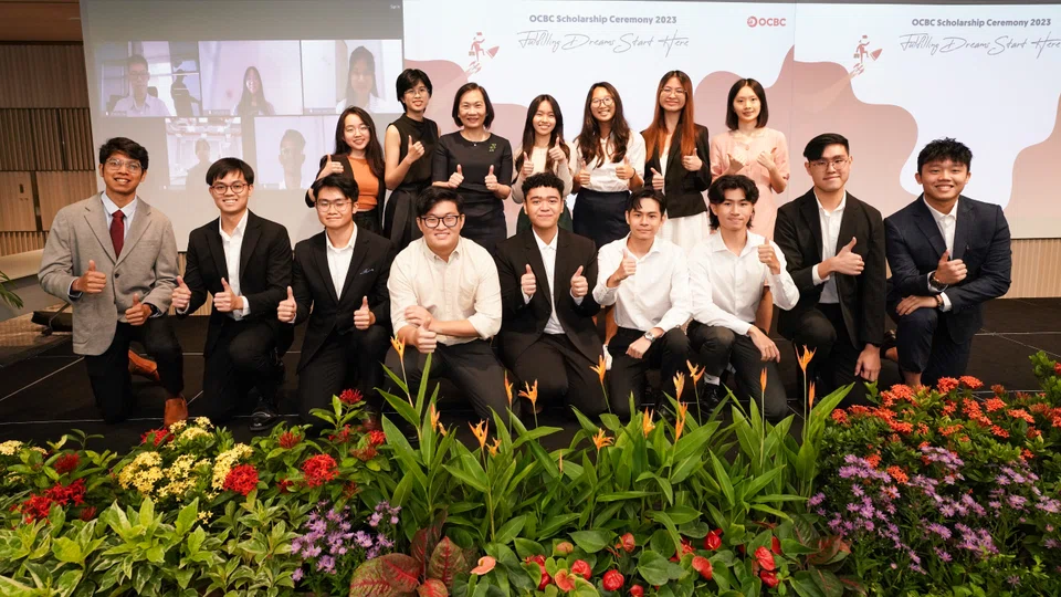 OCBC's group chief executive Helen Wong (third from left in the second row) with this year's scholarship recipients.