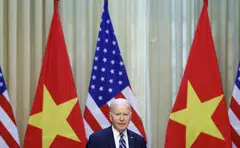 US President Joe Biden touts a "new stage" in the ties between the US and Vietnam to a meeting of officials and executives in Hanoi.