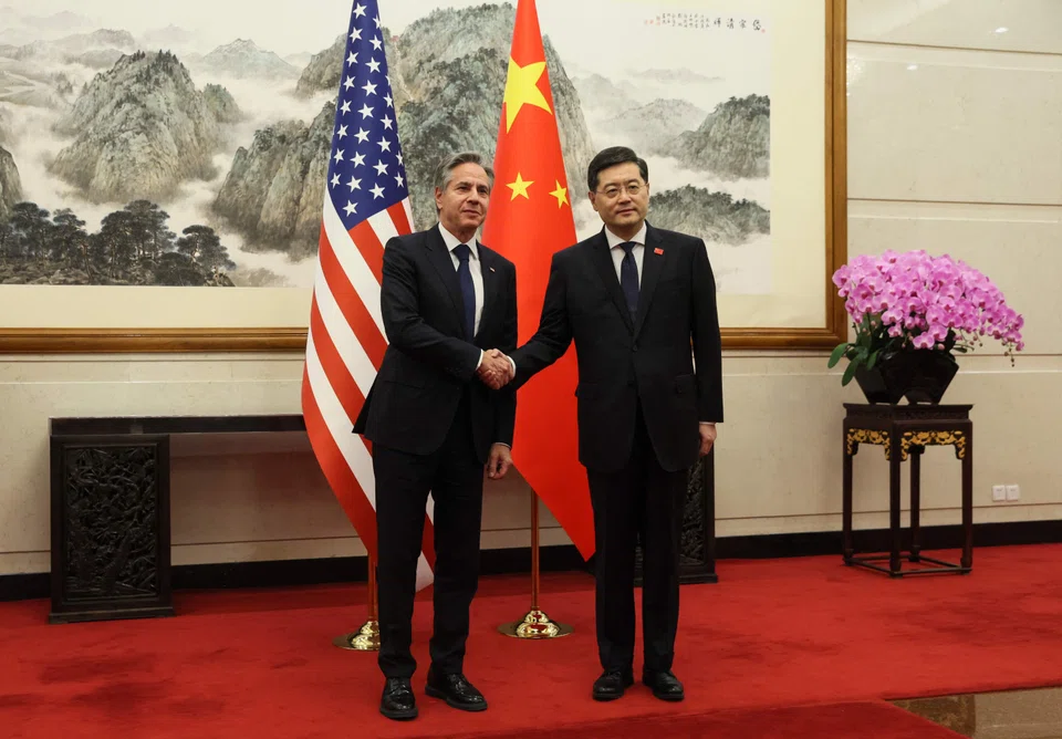 US Secretary of State Antony Blinken (left) and China's Foreign Minister Qin Gang greeting each other ahead of a meeting at the Diaoyutai State Guesthouse in Beijing on Sunday.