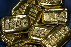 Gold prices fell on Monday due largely to a stronger greenback as investors ready themselves for more interest rate hikes by the Fed and other central banks during the week as they seek to rein in higher inflation. 