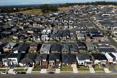 Rampant rises in Australian house prices will grind almost to a halt this year, a Reuters poll of property market analysts found.
