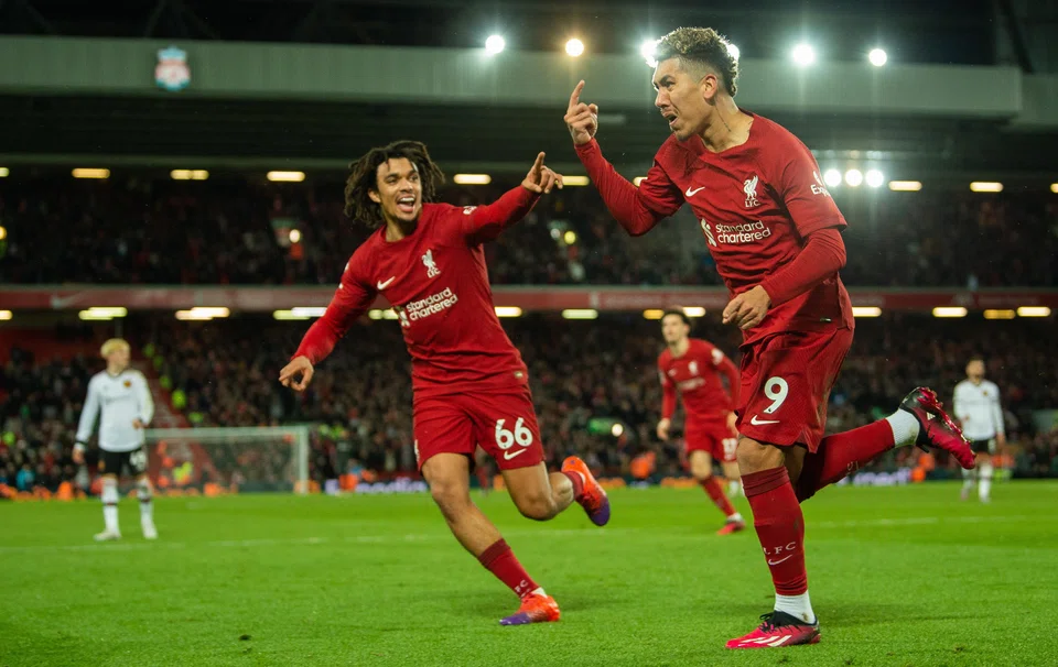 Liverpool's Roberto Firmino celebrates after scoring the 7-0 goal during the English Premier League soccer match between Liverpool FC and Manchester United in Liverpool, March 5, 2023.  
