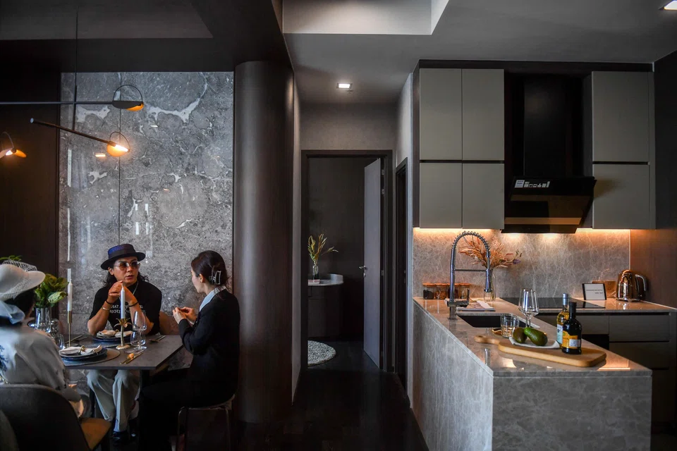 Daniel Bian, a Chinese potential property buyer from Shanghai, visits a luxury condominium in Bangkok, Thailand, April 20, 2023.