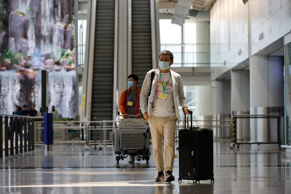 Travellers arrive at the Hong Kong International Airport on Sep 26, the first day the Covid hotel quarantine was scrapped. The easing of Covid containment measures in Hong Kong has lifted hopes that Beijing will do the same.