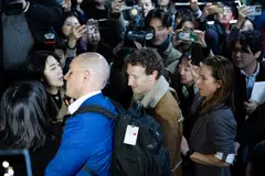 Meta's CEO Mark Zuckerberg (centre), arrives at the LG Electronics headquarters.