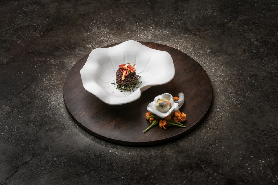 Chocolate fish ball pairs airy chocolate sorbet and candied ikan bilis.