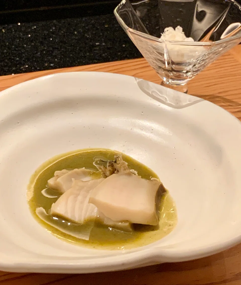 Abalone slices with parmigiano cheese that mixes well with the liver sauce.