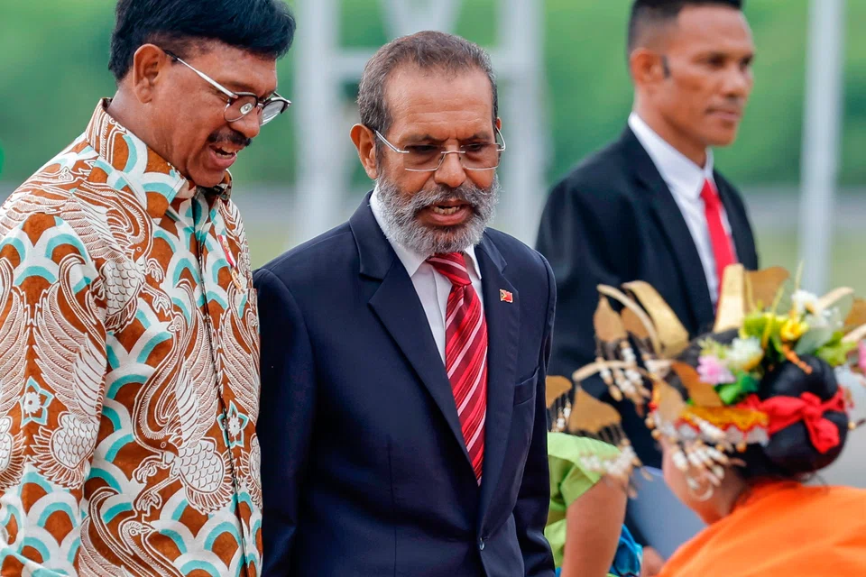 Timor-Leste Prime Minister Taur Matan Ruak (centre) is welcomed by Indonesian Minister of Communication and Information Technology Johnny Plate (left) at Komodo Airport, ahead of the 42nd Asean Summit in Labuan Bajo.