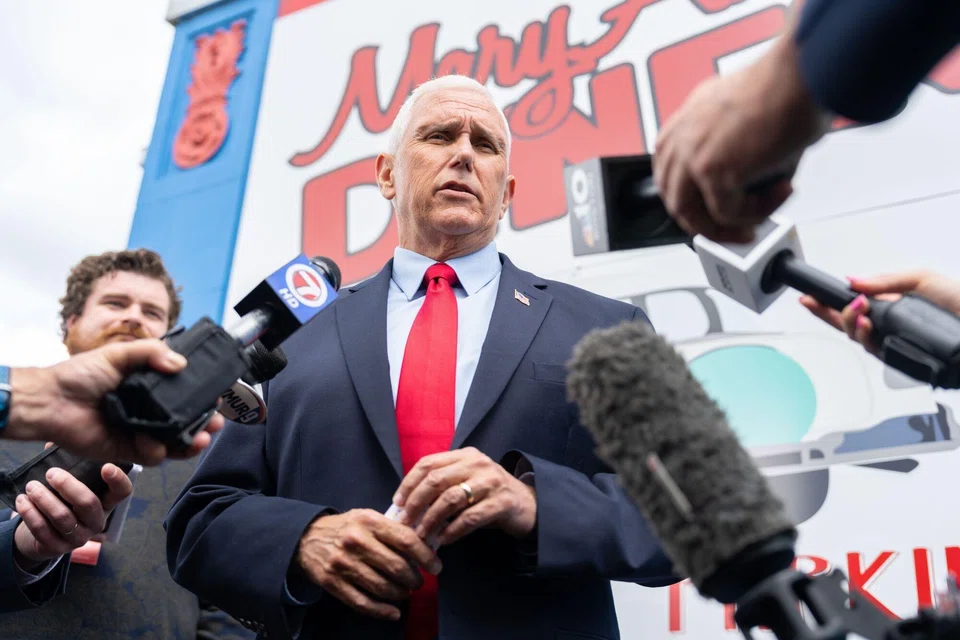 Former US Vice-President Mike Pence speaks to members of the media during a campaign stop in Derry, New Hampshire, June 9, 2023. Several top Republicans, including White House hopefuls Pence and Asa Hutchinson, on Sunday criticised Trump's handling of classified information as rivals plot their potential paths to 2024.