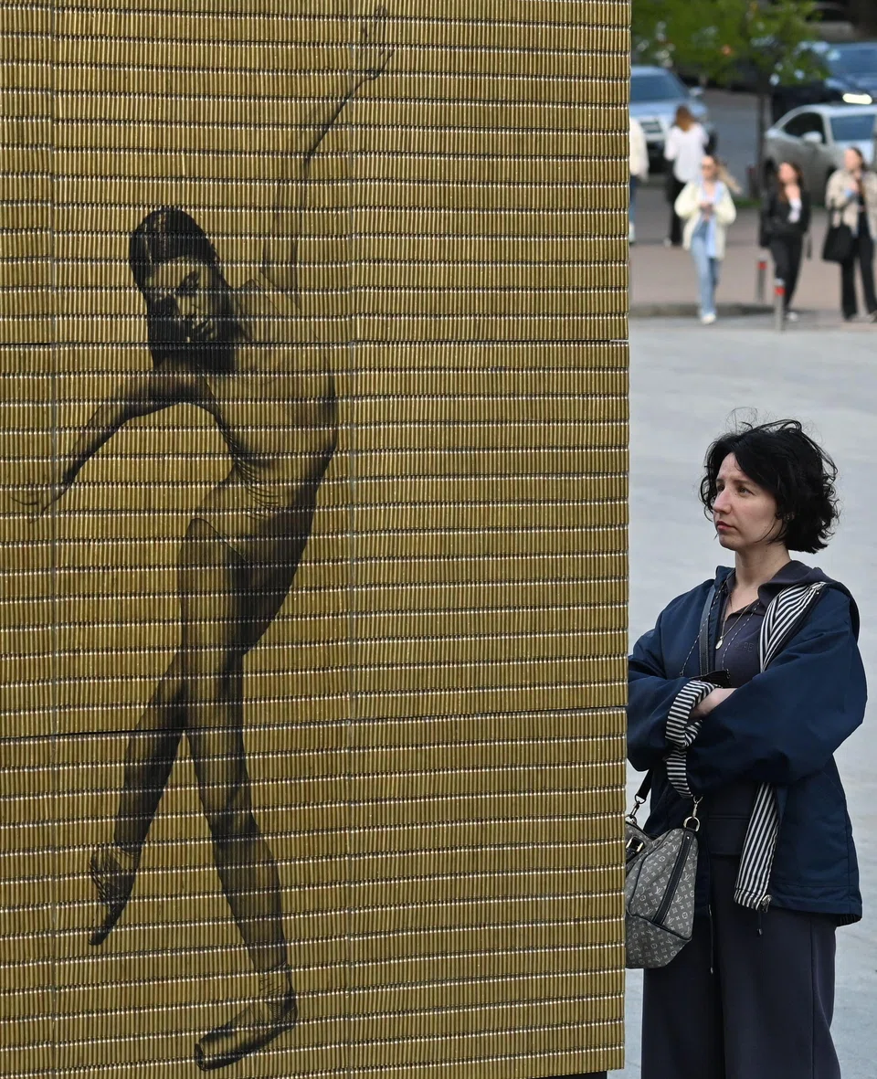 An installation of "Unbroken" - an image of a ballerina printed on bullet casings - by Felipe Jacome and Svitlana Onipko, outside National Opera of Ukraine building.