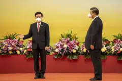 Hong Kong’s new security-minded leader John Lee (left) was sworn in by President Xi Jinping as the city marks 25 years of Chinese rule. 