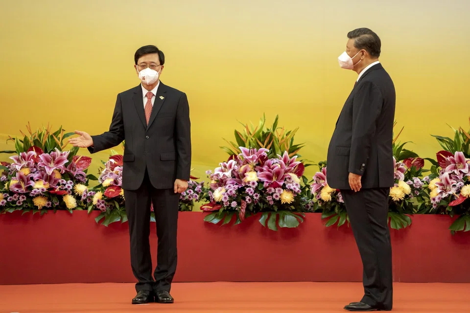Hong Kong’s new security-minded leader John Lee (left) was sworn in by President Xi Jinping as the city marks 25 years of Chinese rule. 