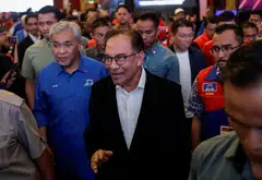 Malaysian PM Anwar Ibrahim, with Umno president Ahmad Zahid Hamidi on his right, leaving a press conference in Kuala Lumpur after the release of the state election results on Saturday;  it will require all of his ingenuity and ability to coalesce opposing forces to hold the unity government together.