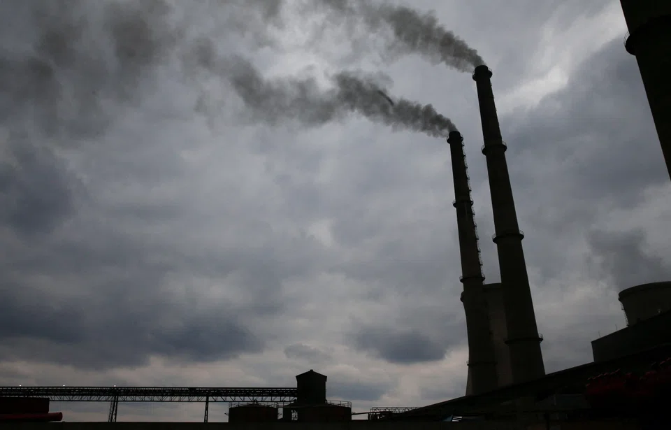 Smoke rises from chimneys at Hwange Power station in Hwange, Zimbabwe, October 19, 2021. Picture taken October 19, 2021 REUTERS/Philimon Bulawayo