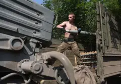 Ukrainian artillerymen load a BM-21 Grad multiple rocket launcher near Izyum, south of Kharkiv, on June 11, 2022. Ukraine President Volodymyr Zelensky on Sunday confirmed Ukrainian troops had recaptured the strategic city of Izyum.