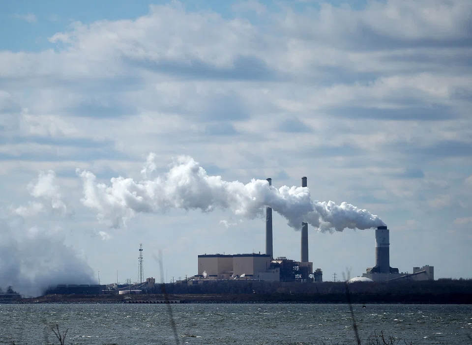 In this file photo taken on March 9, 2018, emissions spew from a large stack at the coal-fired Brandon Shores Power Plant, in Baltimore, Maryland., US. The US Senate has passed a US$370b bill to move America away from fossil fuels and toward renewable energy sources. 
