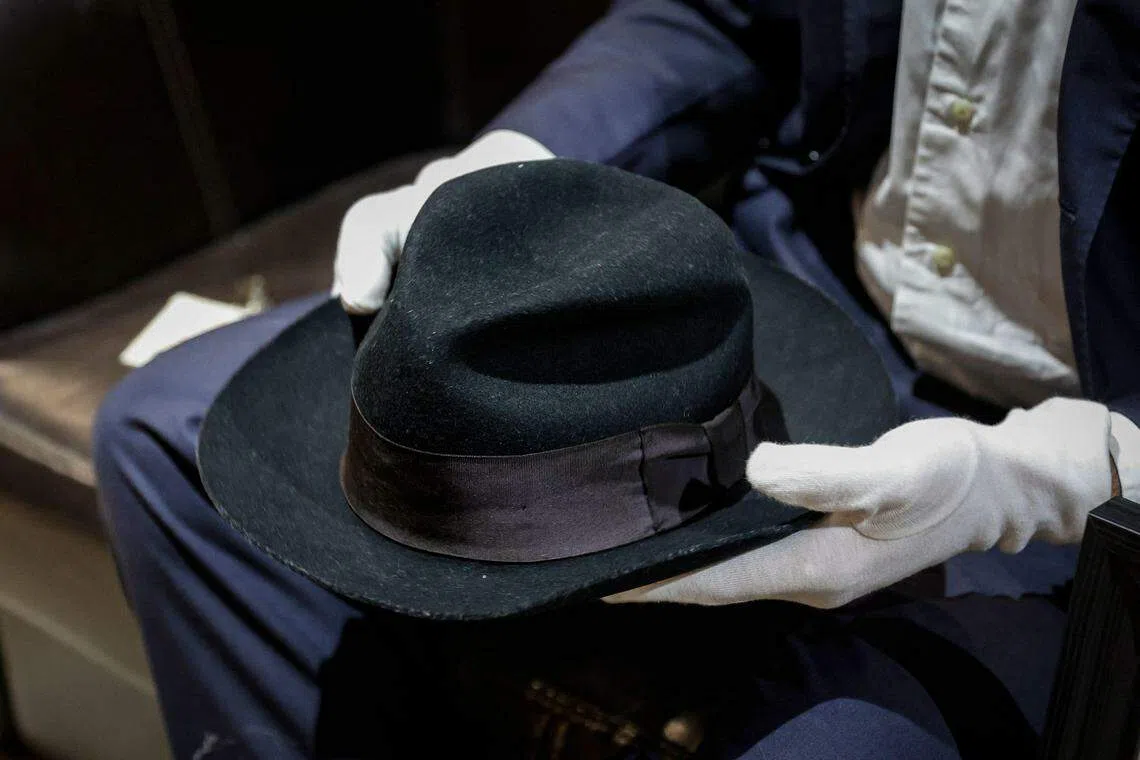 A Fedora hat that belonged to US singer Michael Jackson, made of wool and lined with silk, is displayed before being put on sale at an auction in Paris. It's expected to fetch between US$64,000 and US$107,000. 