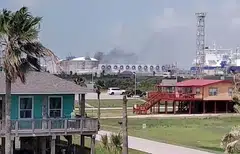 Smoke billows from the Freeport LNG plant in Quintana, Texas, June 8, 2022. Freeport LNG said a partial resumption of activities was targeted for 90 days, but “a return to full plant operations is not expected until late 2022.”