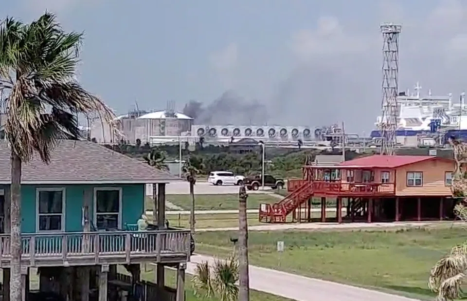 Smoke billows from the Freeport LNG plant in Quintana, Texas, June 8, 2022. Freeport LNG said a partial resumption of activities was targeted for 90 days, but “a return to full plant operations is not expected until late 2022.”