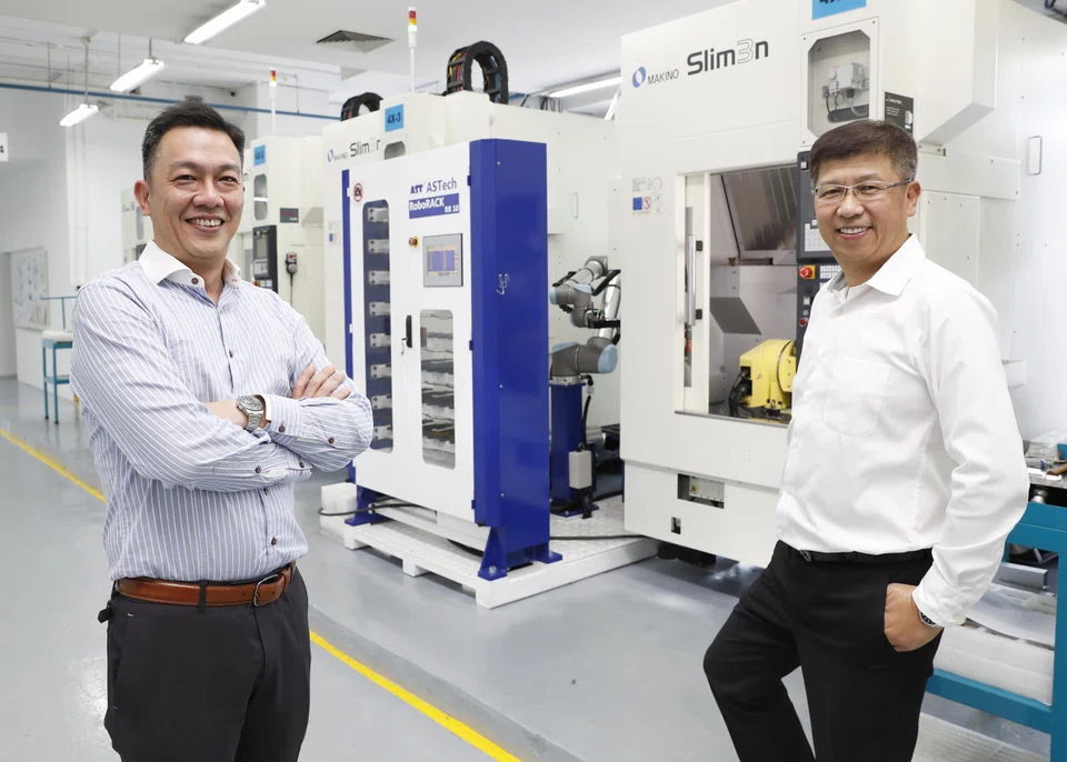 Grand Venture Technology chief executive Julian Ng (left) and executive chairman Ricky Lee. The group saw revenue for Q1 fall 17 per cent to S$26.9 million.