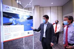 Hsieh Fu Hua (right), chairman of SBF Foundation showing Chee Hong Tat around, along with Fong Yong Kian (middle), chief executive of Tote Board
