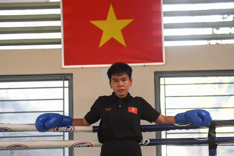 This photo taken on April 22, 2022 shows boxer Nguyen Thi Thu Nhi, Vietnam's first world boxing champion, during a training session at the Ho Chi Minh City National Sports Training Center in Ho Chi Minh City. - From her youth spent scraping a living on the streets, Nguyen Thi Thu Nhi battled poverty and sexist prejudice to become Vietnam's first boxing world champion. (Photo by Nhac NGUYEN / AFP) / To go with BOX-WOMEN-MINIFLYWEIGHT-VIE-THI-VIETNAM,INTERVIEW' by Tran Thi Minh Ha