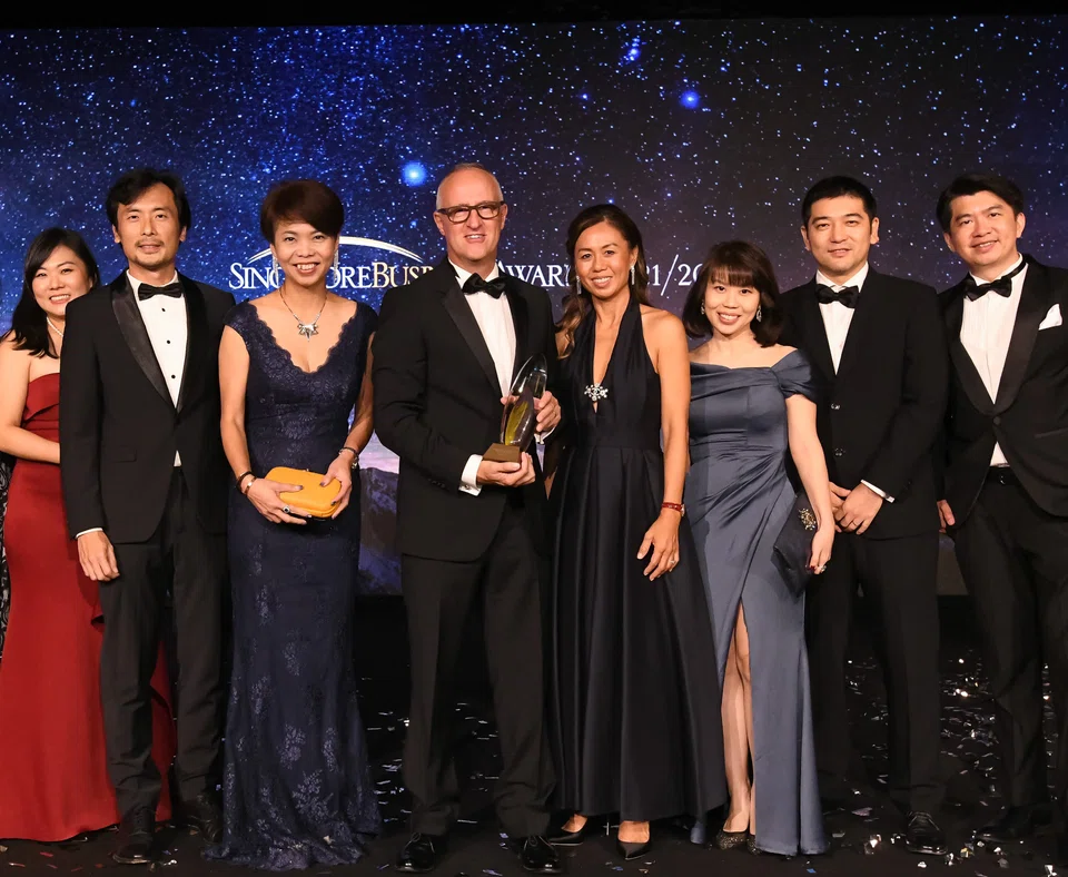 The TDCX crowd with their boss, CEO Laurent Junique (4th from left).