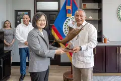Taiwan's President Tsai Ing-wen meets with Belize Prime Minister John Briceno during her visit to the Central American country, April 3, 2023.
