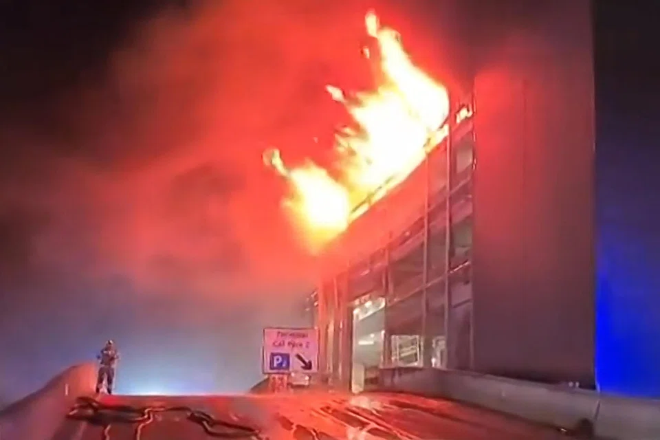 A parking structure on fire at London's Luton Airport. Five people, including four firefighters and an airport employee, were admitted to hospital.