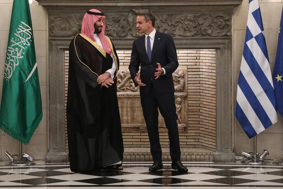 Greek Prime Minister Kyriakos Mitsotakis (right) talks with Crown Prince, Mohammed Bin Salman Bin Abdulaziz Al-Saud (left) after the signing of a series of bilateral agreements in Athens, Greece, July 26, 2022. 