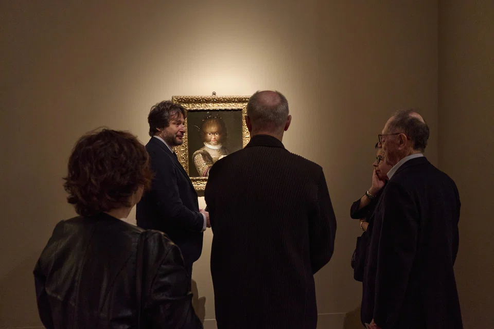 Visitors to the Tefaf Maastricht art fair view a 16th-century portrait by Lavinia Fontana of Antonietta Gonzales, a girl with a condition that caused excessive facial hair. 