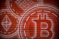 Logos for Binance Coin, top, Ether, left, and Bitcoin inside a cryptocurrency exchange in Barcelona, Spain, on Wednesday, March 9, 2022. Bitcoin dropped back below $40,000, erasing almost all the gains sparked by optimism about U.S. President Joe Biden’s executive order to put more focus on the crypto sector. Photographer: Angel Garcia/Bloomberg