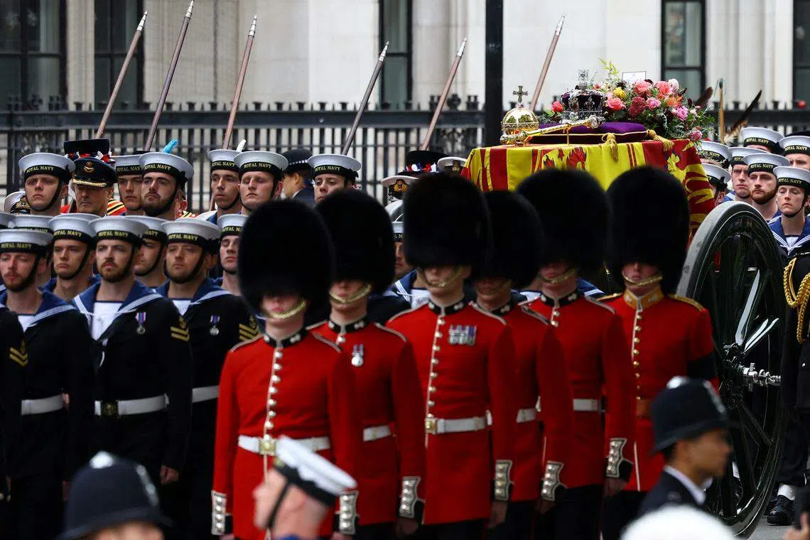 The coffin of Britain's Queen Elizabeth being borne on a gun carriage through London, from Westminster Hall, where it has lain in state for the last 4 days, to Westminster Abbey for the funeral service. 