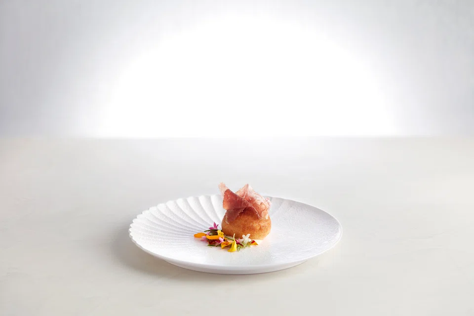 Fried bao stuffed with aged wagyu tartare.