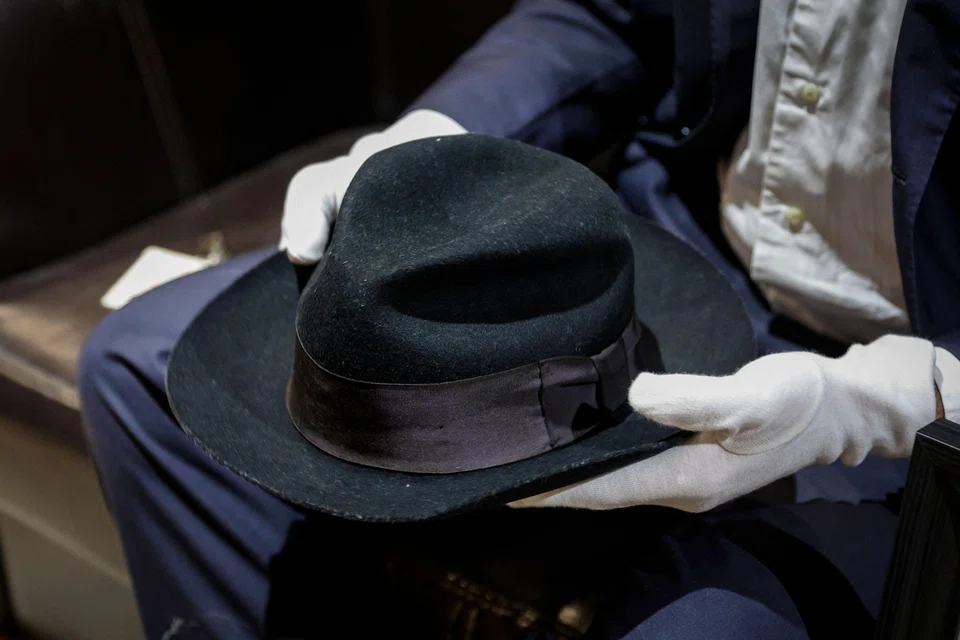 A Fedora hat that belonged to US singer Michael Jackson, made of wool and lined with silk, is displayed before being put on sale at an auction in Paris. It's expected to fetch between US$64,000 and US$107,000. 