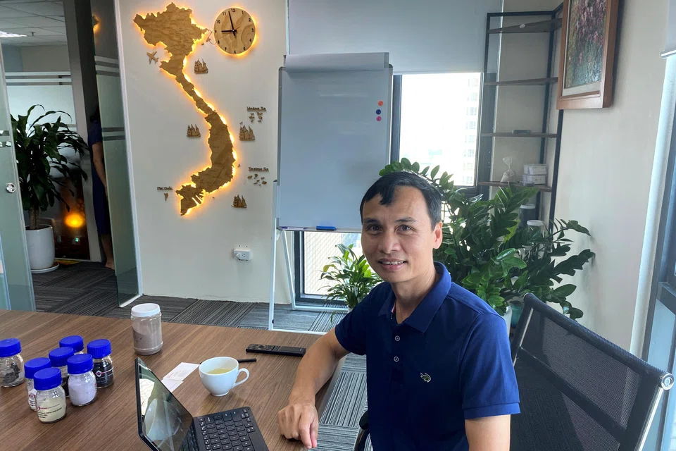 Luu Anh Tuan, chairman of mining company Vietnam Rare Earth JSC (VTRE) in his Hanoi office with samples of rare earth oxides.