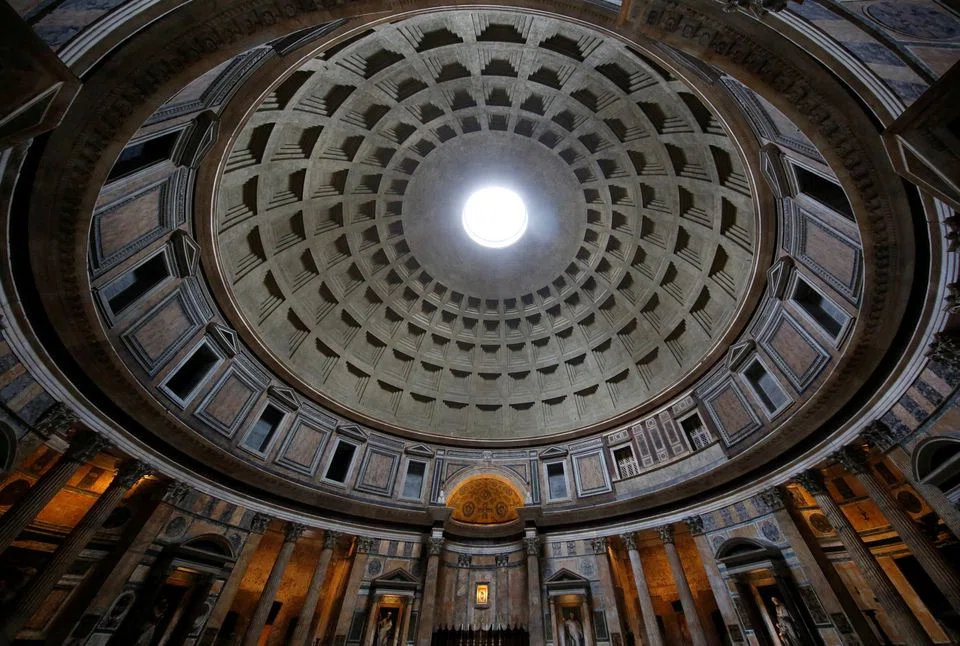 The Pantheon, dating to the 2nd century AD, is a circular concrete building faced with brick, boasting the world’s largest and oldest unreinforced concrete dome. 